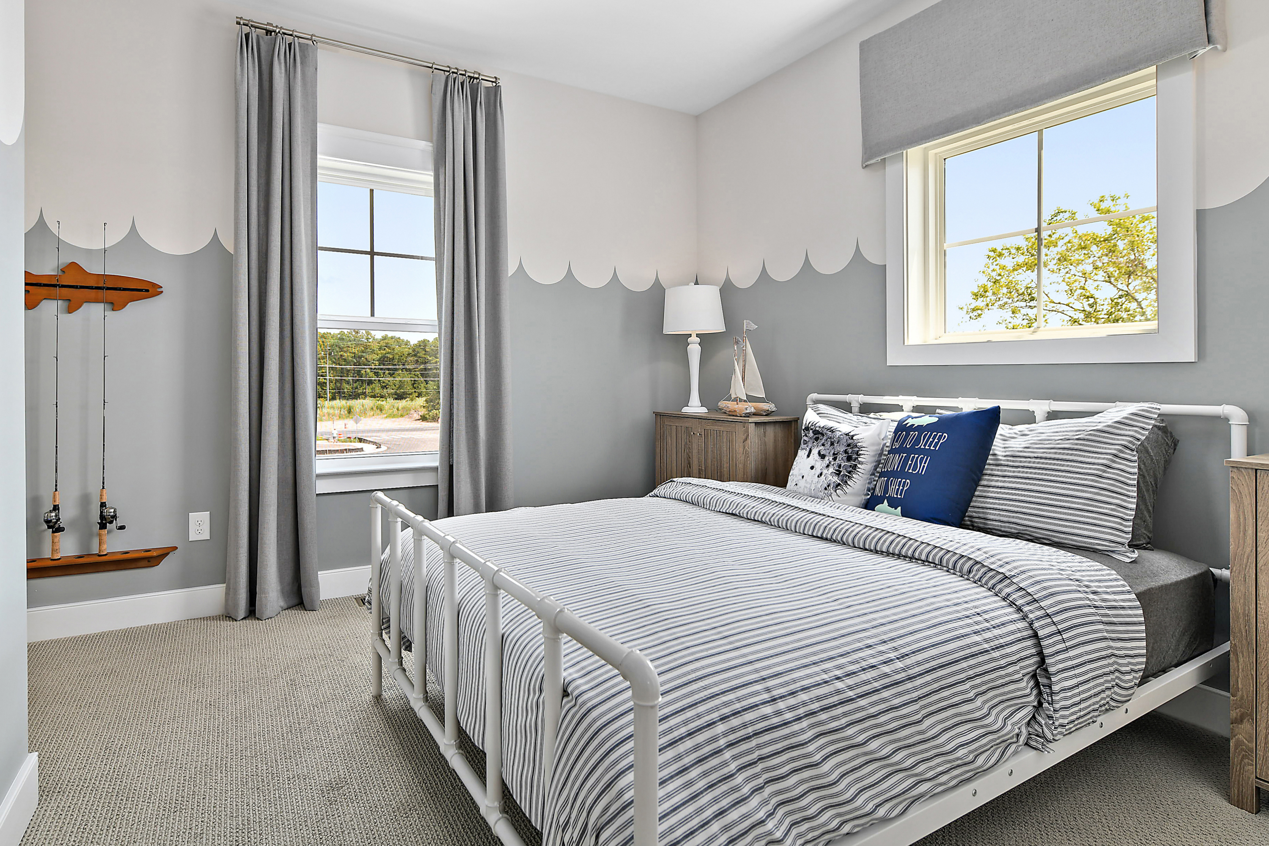 Guest Room Featuring Queen Bed and Large Windows
