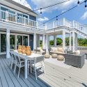 Outdoor living area and dining space in the Sandpiper luxury homes for sale in Delaware