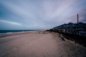 Bethany beach sand and ocean with oceanfront homes
