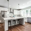 Modern kitchen with large kitchen island and stainless steel appliances in McLean, Virginia home