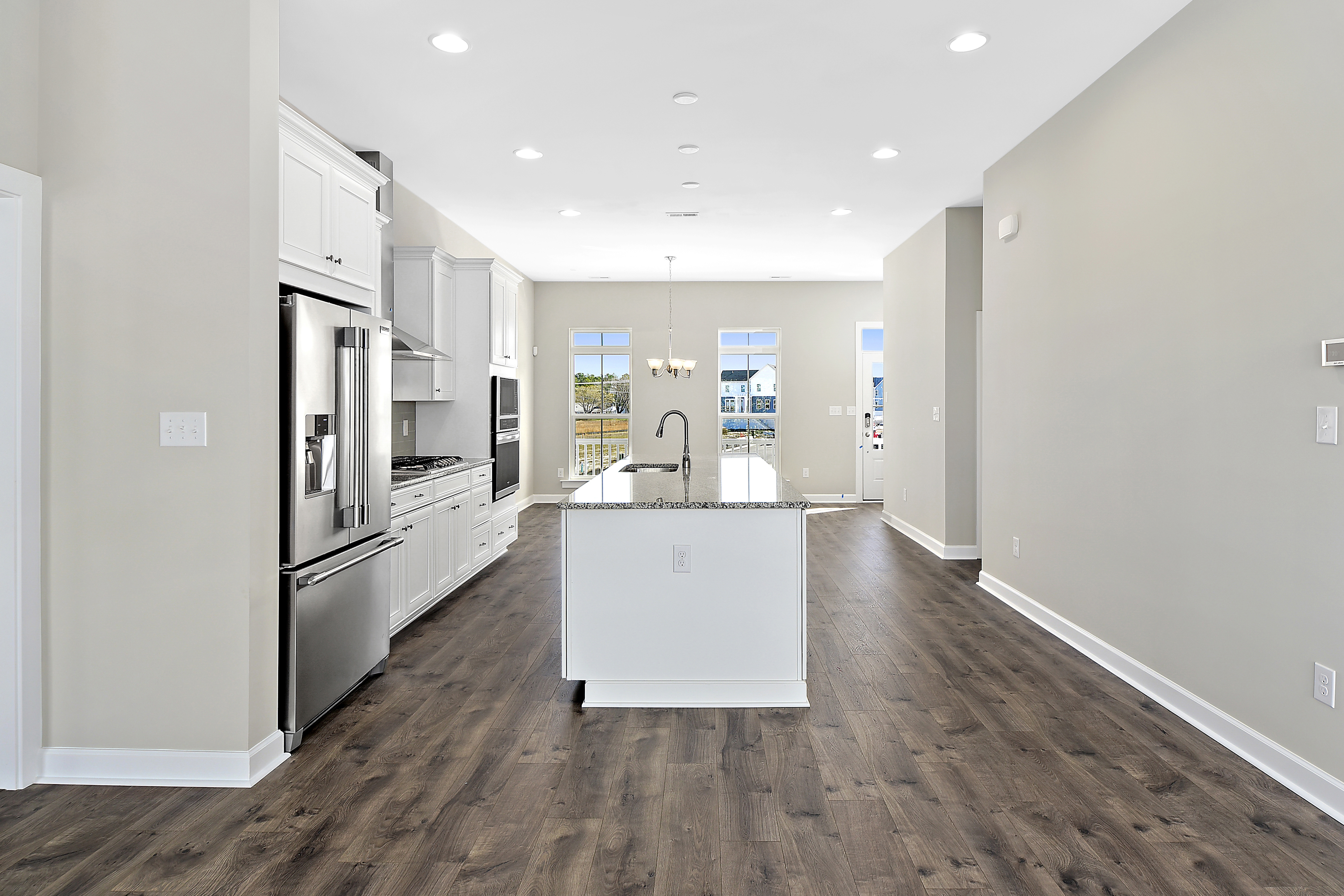 Side view of the gourmet kitchen and large center island in Turnstone home