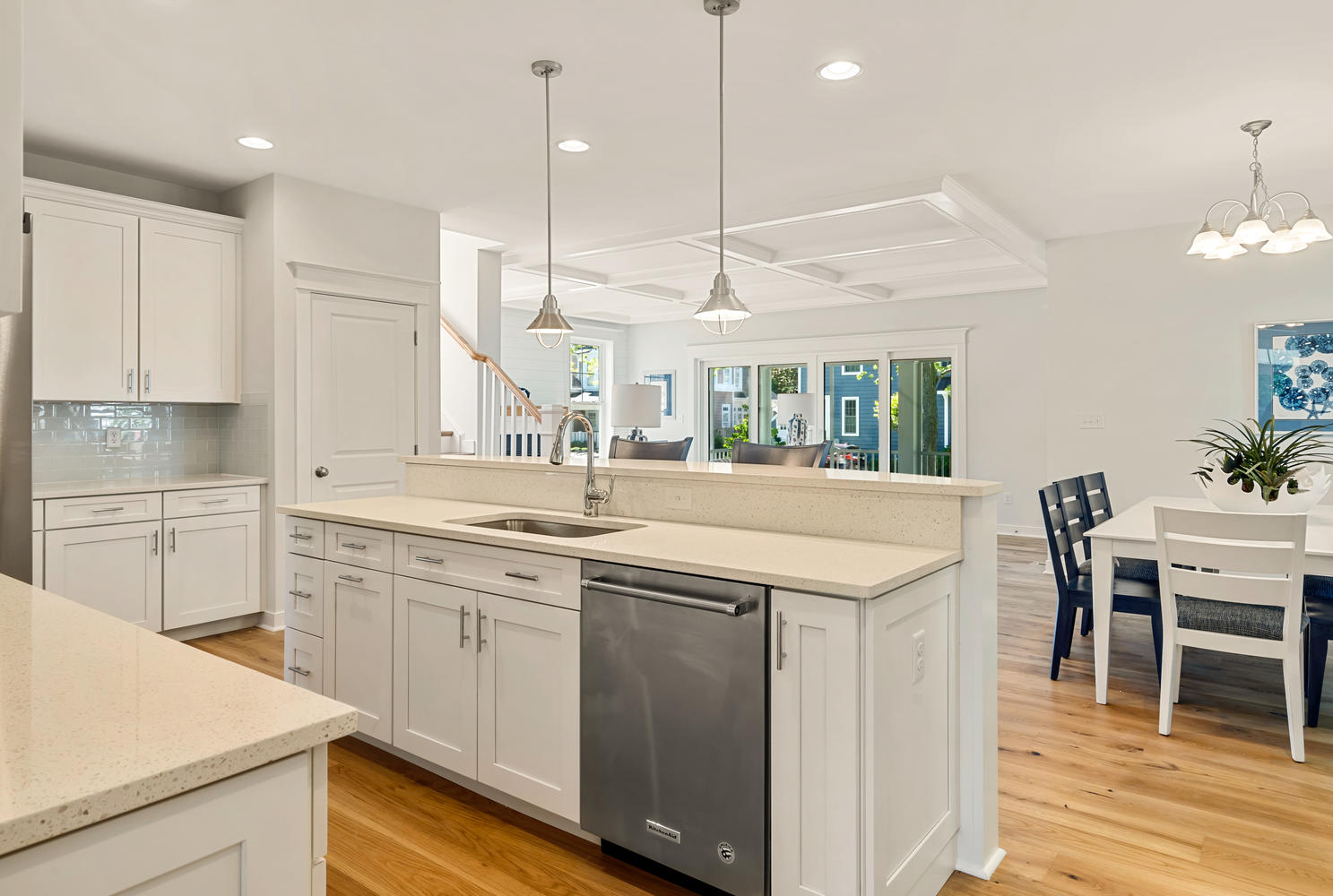 Kitchen with White Cabinets, Quartz Counters, and Stainless Steel Appliances