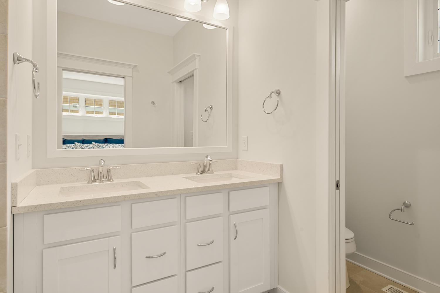 Guest Bath with Double Vanity Sink and White Cabinets