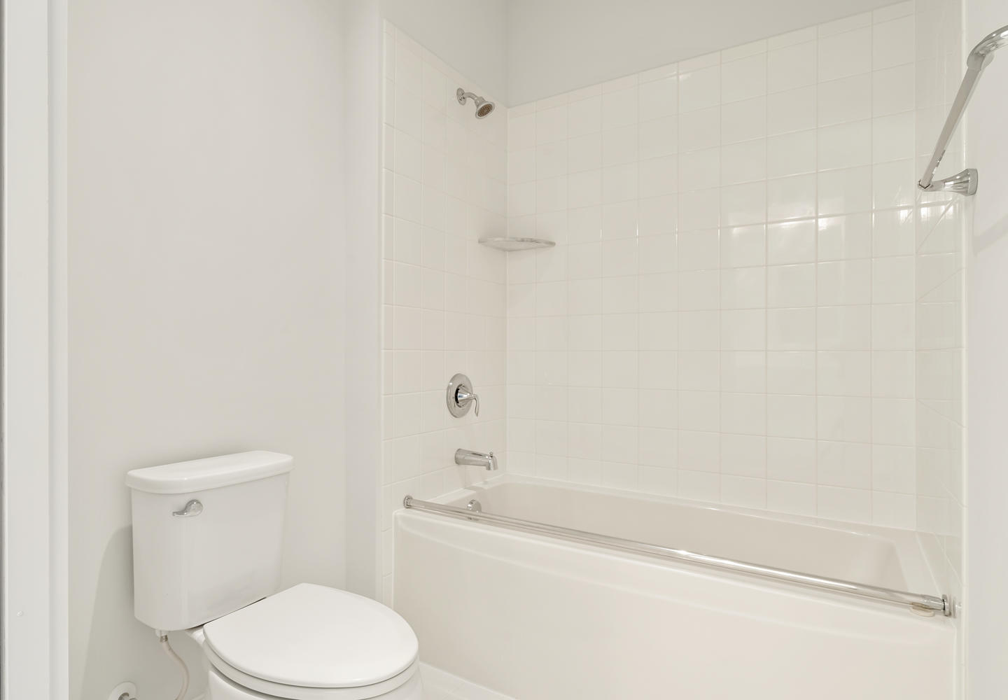 Guest Bath with Tub and White Tile