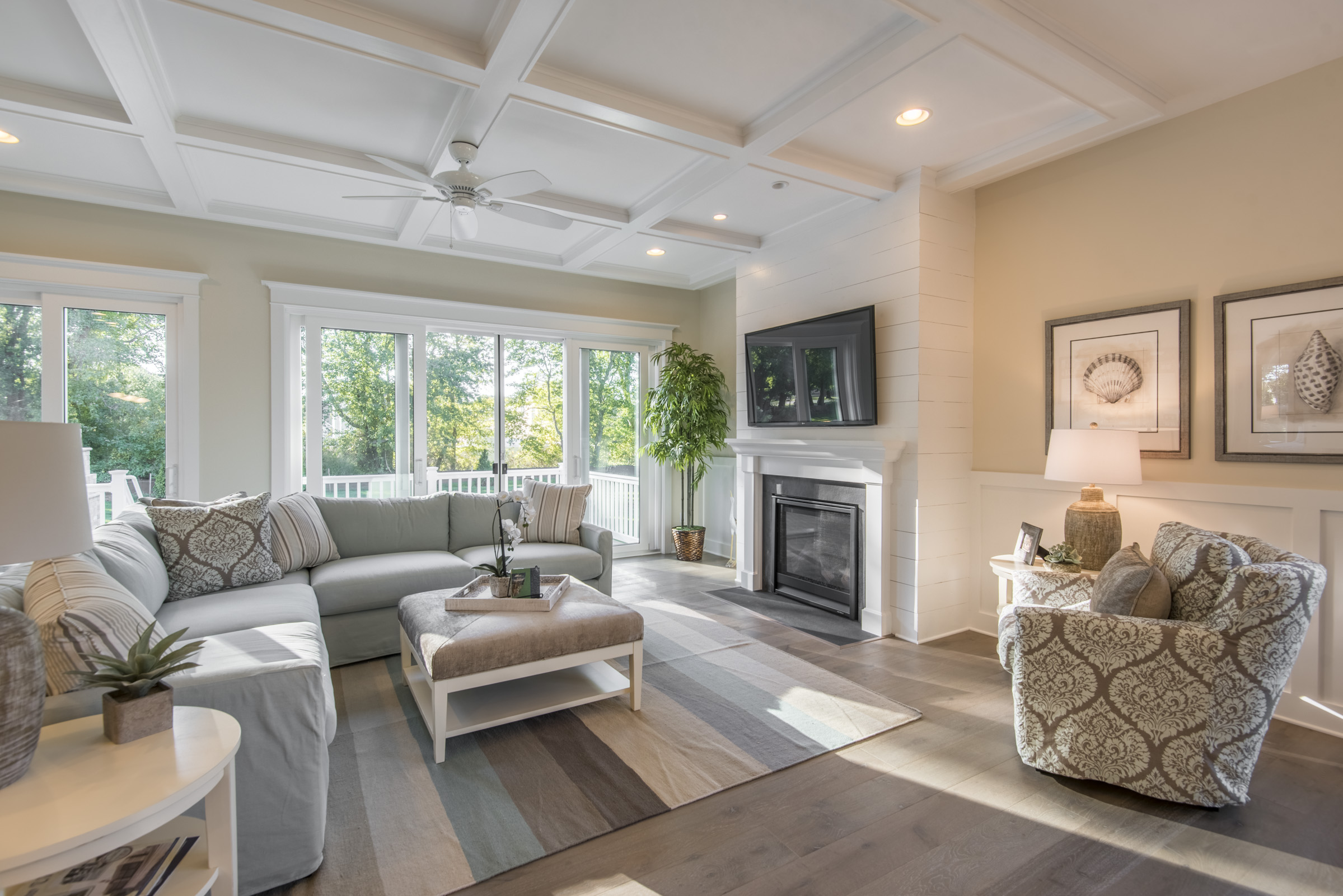 Open Concept Living Area with Coffered Ceiling and Fireplace