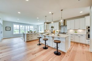 Bright open concept kitchen and dining area with large center island