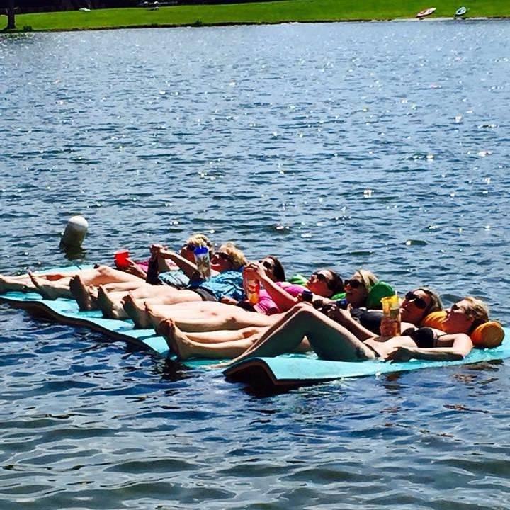 COVE lake group friends on rafts