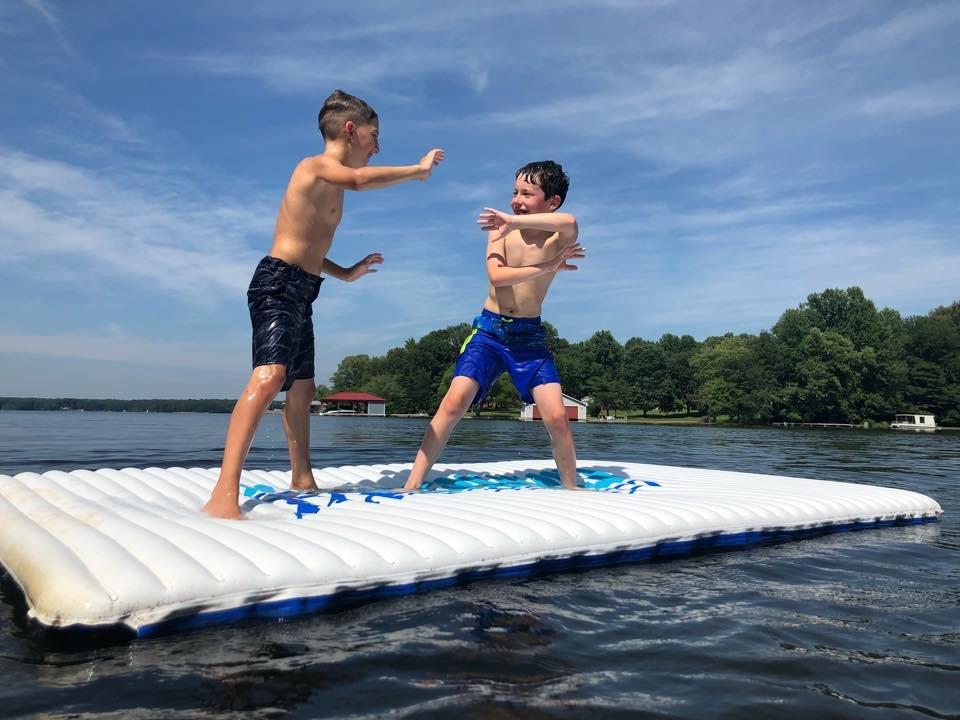 COVE lake kids on raft on water