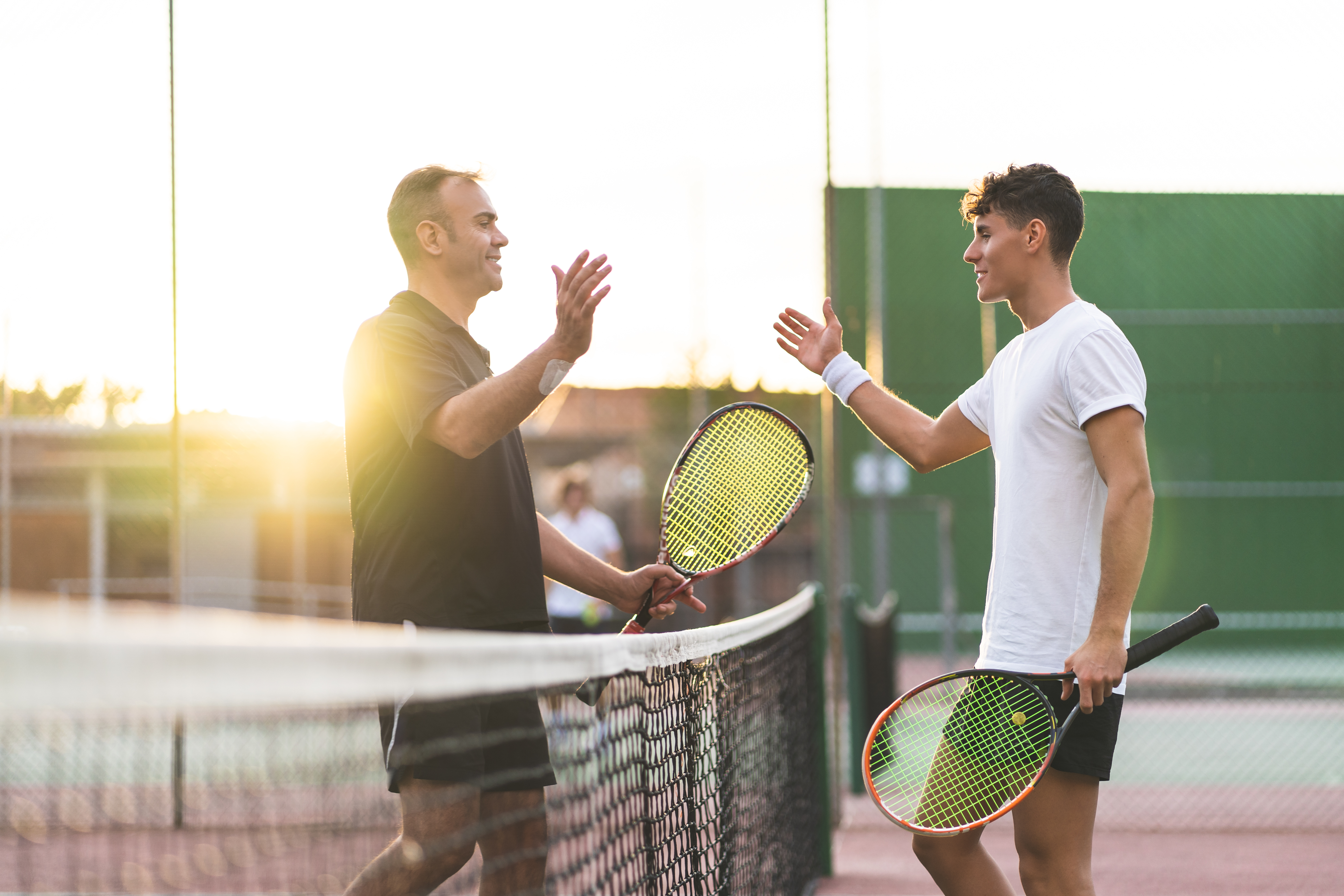 Father,And,Son,Playing,Tennis,One,To,One.,Family,Doing
