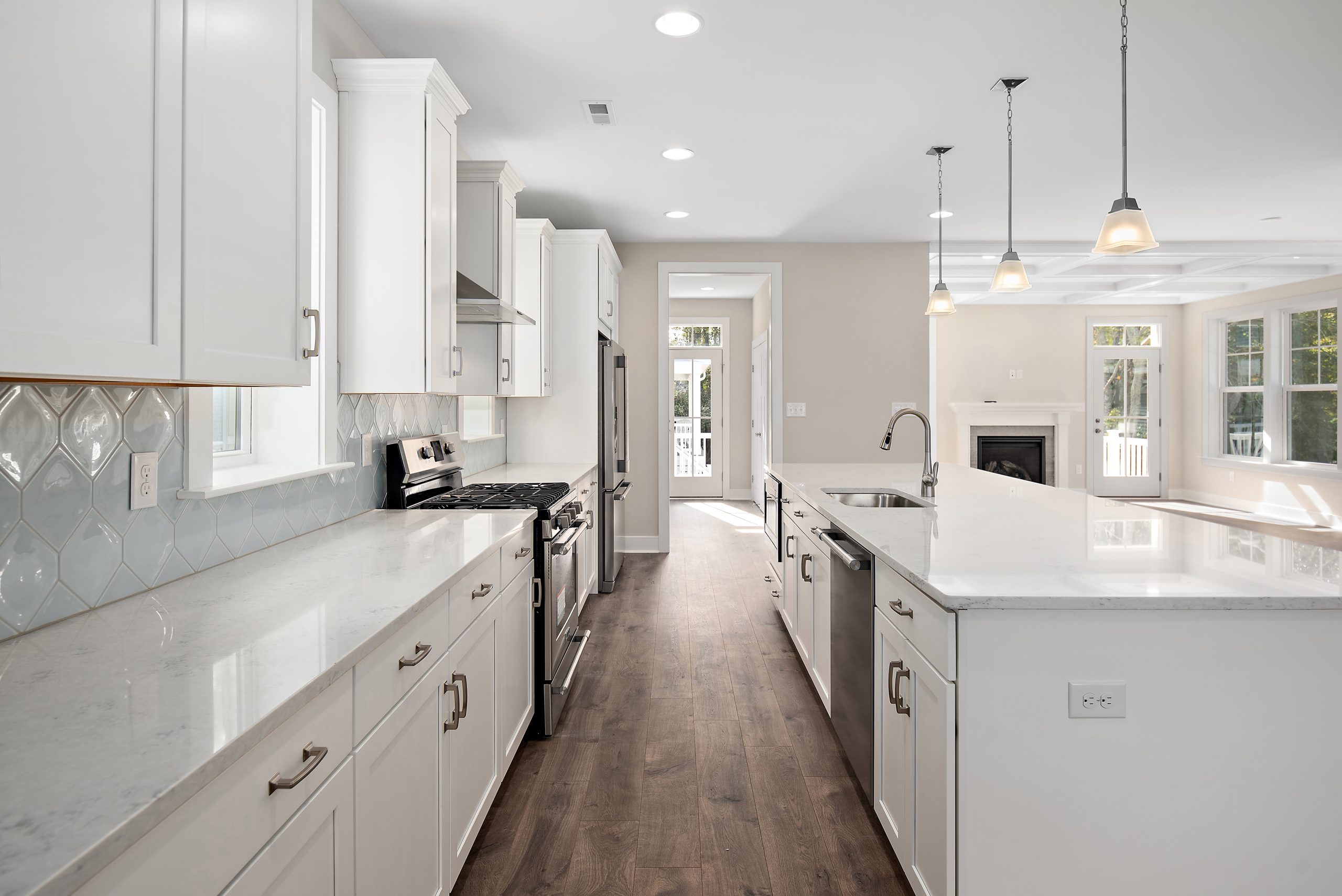 Gourmet kitchen with white cabinets and lots of counter space in Mallard floorplan