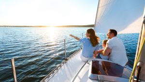 Sea,Cruise.,Family,Sitting,On,Yacht,Deck,Sailing,Across,The