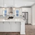 Gourmet kitchen with large center island in custom built home by Evergreene Homes