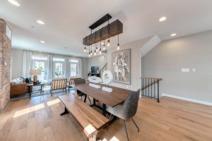 Dining room with exposed brick in luxury townhome