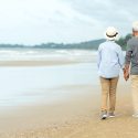 Asian,Lifestyle,Senior,Couple,Walking,Chill,On,The,Beach,Happy