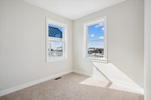 Cozy bedroom with modern decor in the Linwood floor plan.