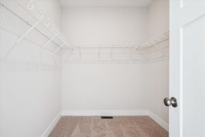 Spacious walk-in closet with built-in shelving in the Linwood floor plan.