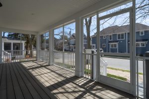 Inside Screened Porch Looking at Street Scape