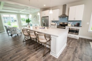 Kitchen with large center island and stainless steel appliances in bethany beach townhome