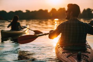 Two people kayaking in the White Creek at Bethany Beach, DE community