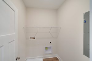 Modern kitchen with stainless steel appliances in the Magnolia floor plan.