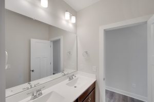 Modern kitchen with stainless steel appliances in the Magnolia floor plan.