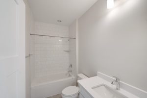 Open-concept living area with contemporary furniture in the Magnolia floor plan.