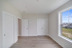 Cozy secondary bedroom with modern decor in the Magnolia floor plan.