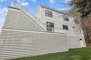 Coastal-style back elevation of the Campbell floor plan home