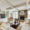 great-room-coffered-ceilings-stone-fireplace Spacious and naturally lit family room with coffered ceilings and built in storage