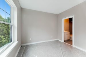 Bedroom in Campbell floor plan with modern decor.