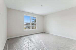 Modern primary bedroom in the Campbell floor plan home
