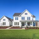 The exterior of the Millwright II floorplan, on a brilliant sunny day on a large home site