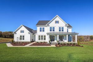 The exterior of the Millwright II floorplan, on a brilliant sunny day on a large home site