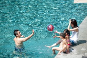 Happy,Asian,Family,Playing,In,The,Pool
