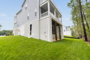 Front porch of the Brackish Dr. home with welcoming decor.