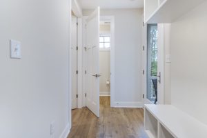 Open-concept living area with contemporary furniture in the Brackish Dr. home.