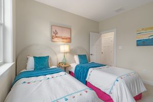 Modern laundry room with storage in the Brackish Dr. home.