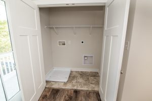 Coastal-inspired exterior of the Blue Fin floor plan home