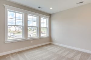 Modern bedroom in the Aquinnah floor plan home