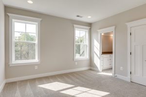Modern bedroom in the Aquinnah floor plan home