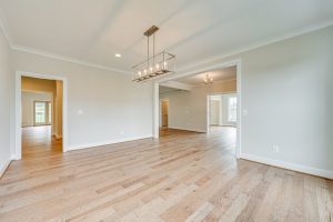 Living room in Cambridge-II floor plan with decor.