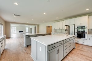 Living room in Cambridge-II floor plan with decor.