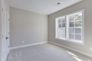 Bedroom in Keene Mill floor plan with modern decor.