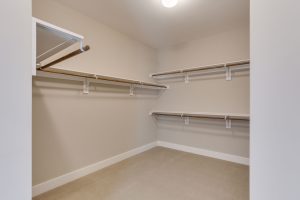 Living room in Keene Mill floor plan with decor.