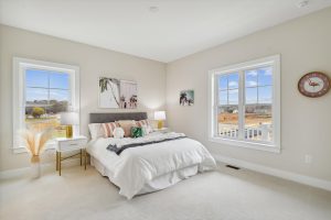 Cozy upper-level bedroom in the Bayberry floor plan home