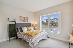 Modern upper-level bedroom in the Bayberry floor plan home